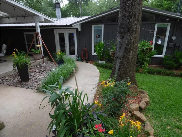 a front view of a house with garden