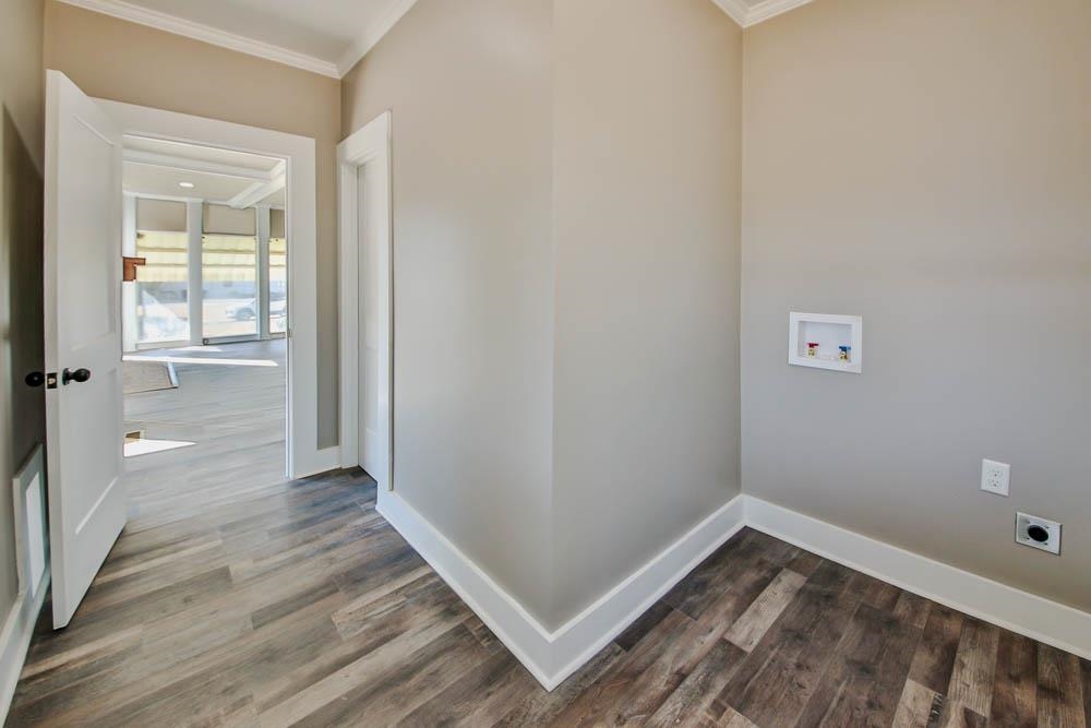 3420 Durhamville Road Ripley, TN 38063 - Photo 19 of 25 a view of a hallway with wooden floor