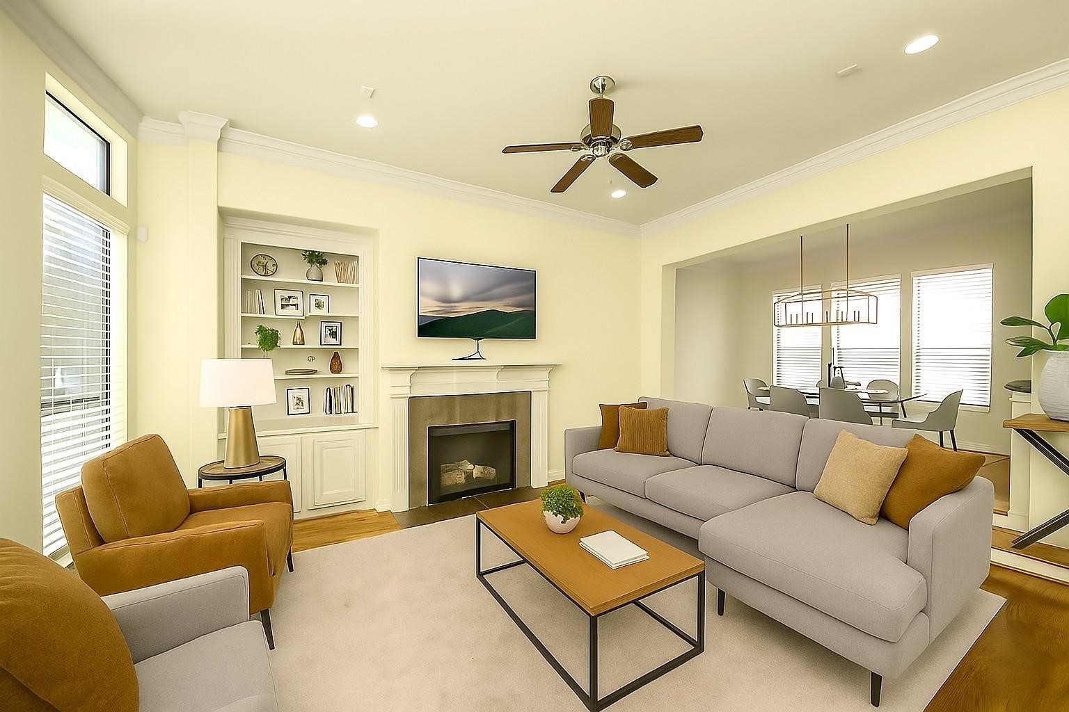 5617 Kiam Street, Unit A Houston, TX 77007 - Photo 21 of 46 a living room with furniture a flat screen tv and a fireplace