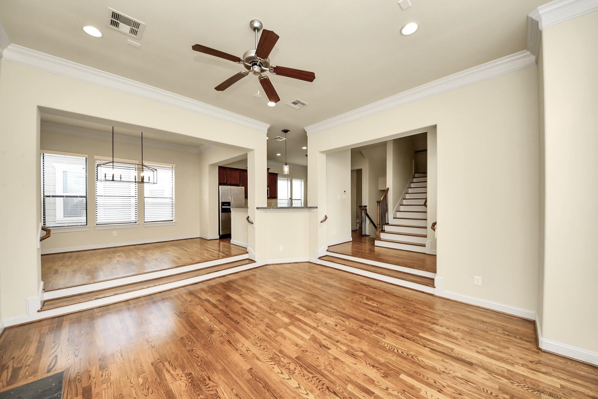 5617 Kiam Street, Unit A Houston, TX 77007 - Photo 24 of 46 a view of an empty room with wooden floor and a window