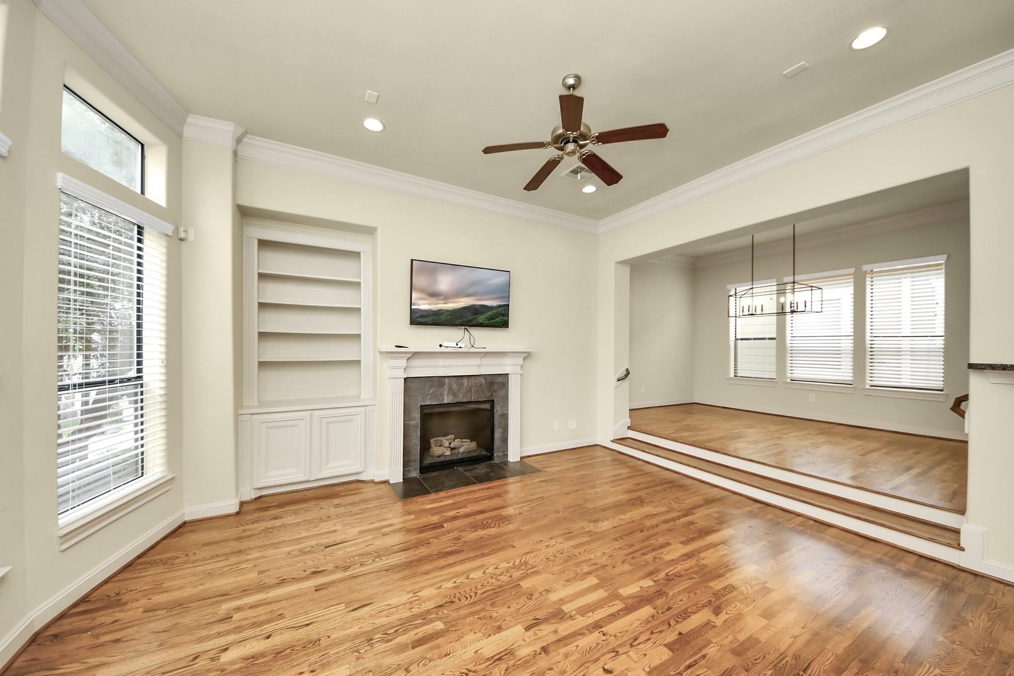 5617 Kiam Street, Unit A Houston, TX 77007 - Photo 25 of 46 a view of livingroom with hardwood floor and a ceiling fan