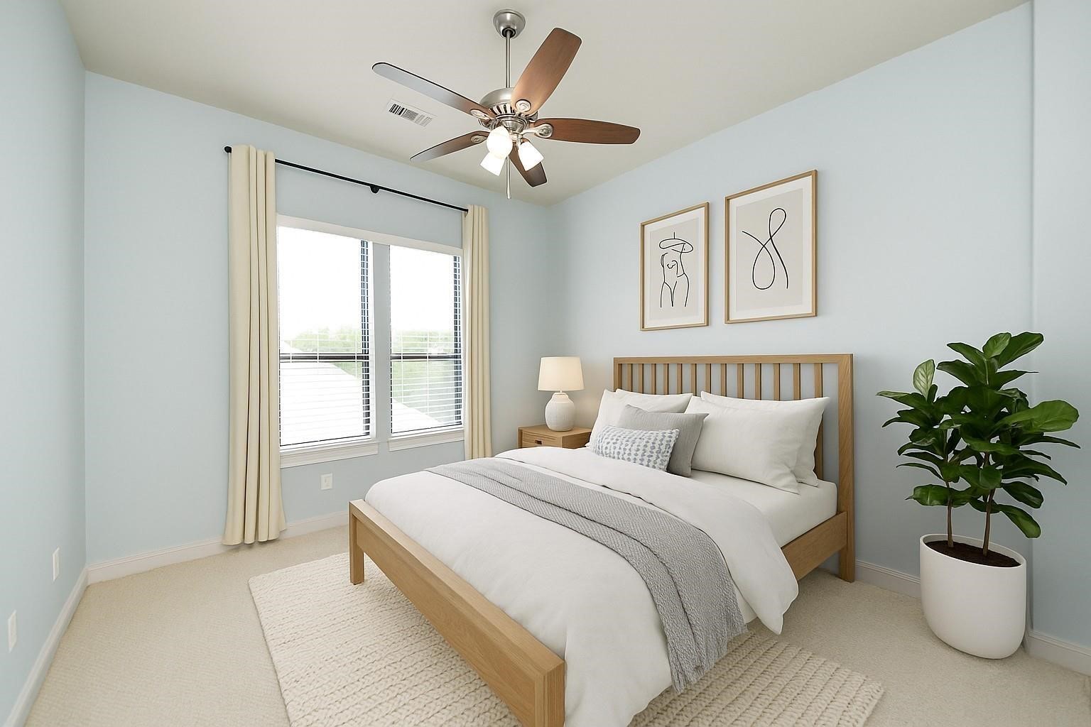 5617 Kiam Street, Unit A Houston, TX 77007 - Photo 38 of 46 a bedroom with a large bed and a potted plant