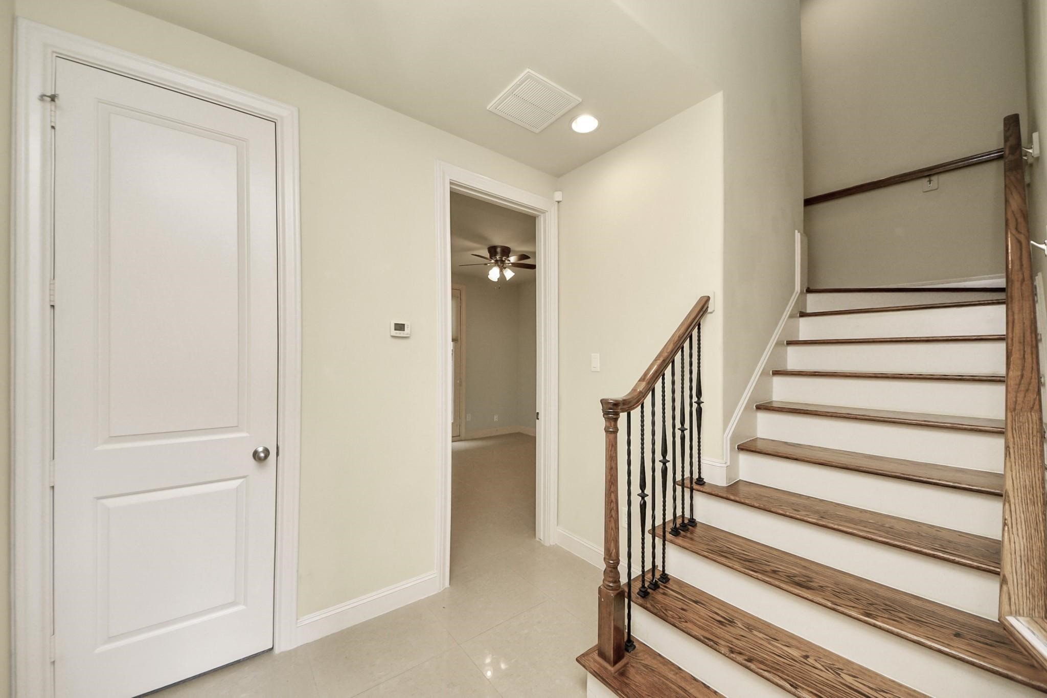5617 Kiam Street, Unit A Houston, TX 77007 - Photo 5 of 46 a view of entryway with wooden floor and stairs