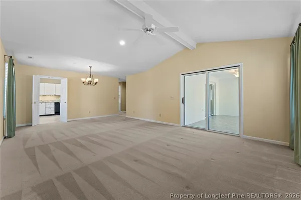 a view of an empty room with a bathroom