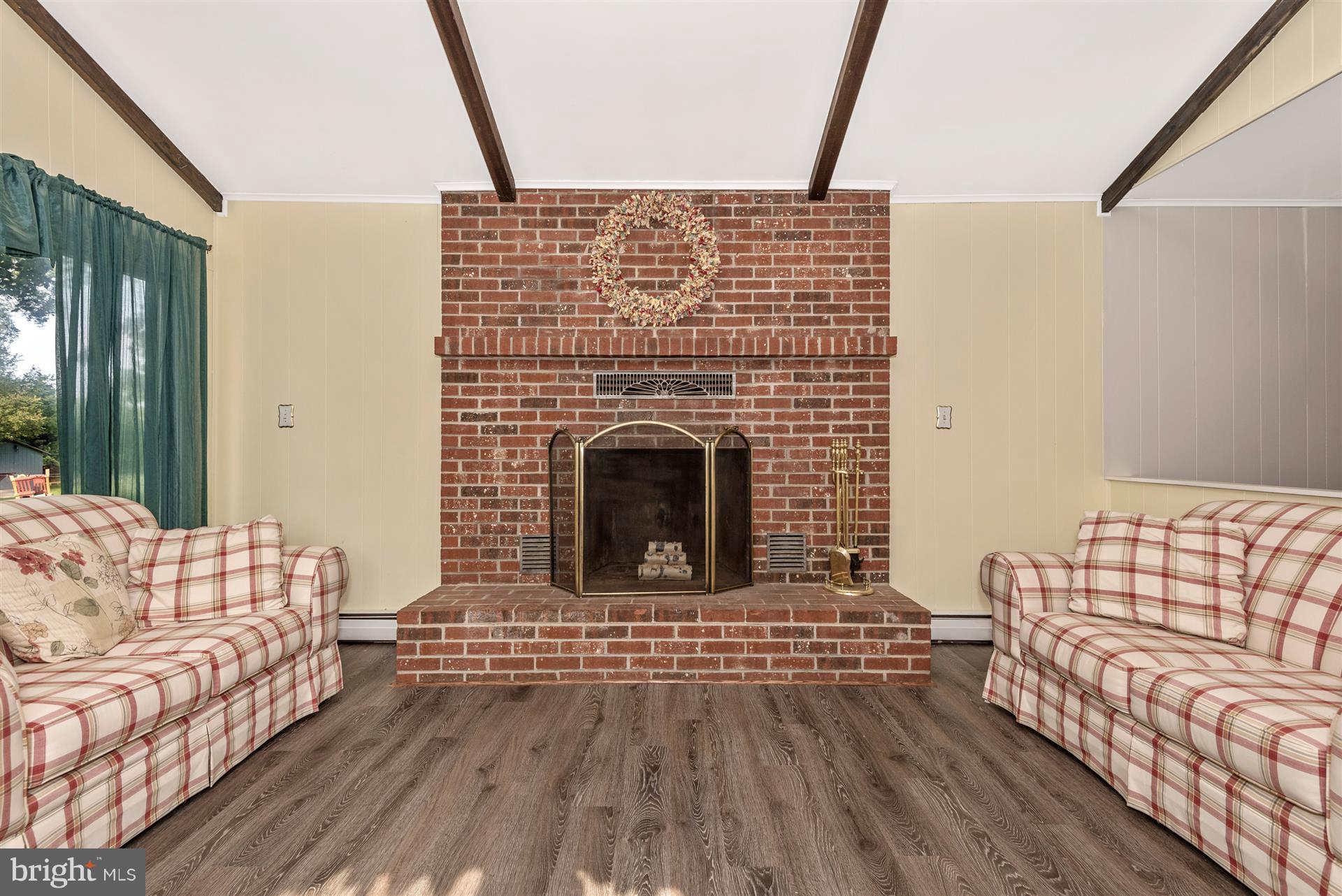 7829 Rocky Road Gaithersburg, MD 20882 - Photo 9 of 32 Family Room with wood burning fireplace