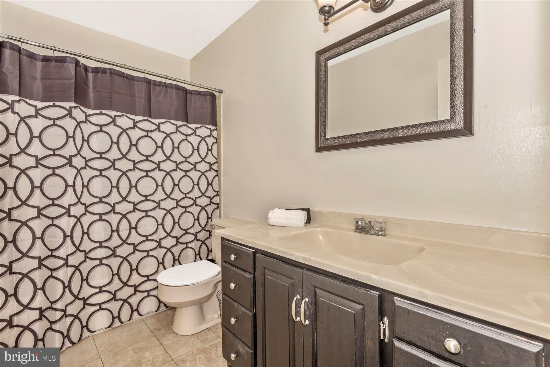7829 Rocky Road Gaithersburg, MD 20882 - Photo 10 of 32 Bathroom with ceramic tile floors