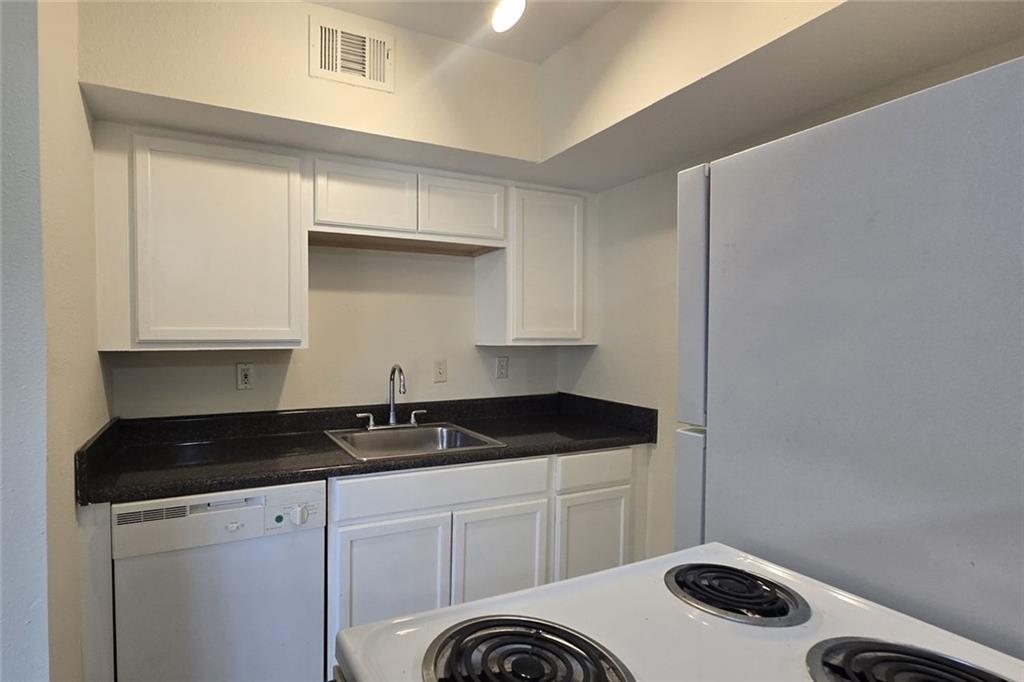 1418 Foxhall Lane Southeast, Unit 8 Atlanta, GA 30316 - Photo 12 of 41 a kitchen with a sink and cabinets