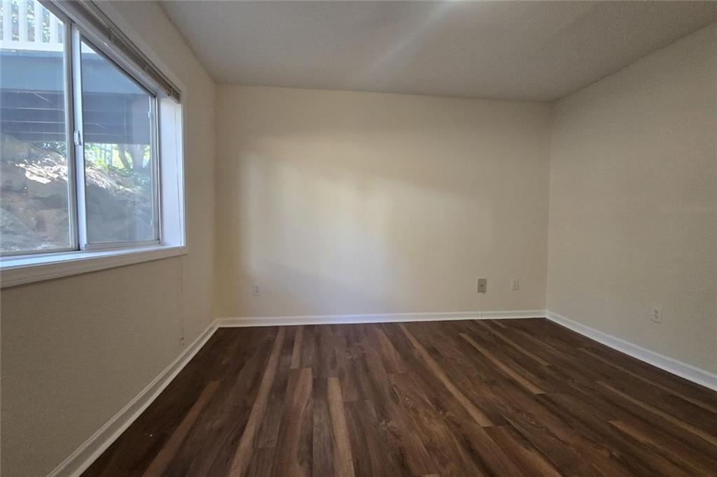 1418 Foxhall Lane Southeast, Unit 8 Atlanta, GA 30316 - Photo 17 of 41 a room view with wooden floor and windows