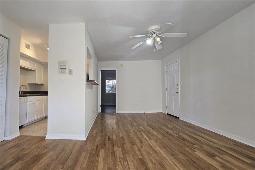 1418 Foxhall Lane Southeast, Unit 8 Atlanta, GA 30316 - Photo 19 of 50 a view of a kitchen with a dishwasher cabinets and wooden floor