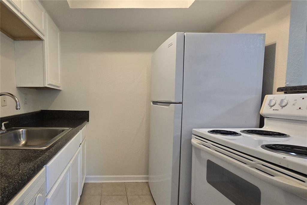 1418 Foxhall Lane Southeast, Unit 8 Atlanta, GA 30316 - Photo 20 of 50 a kitchen with a stove and a sink