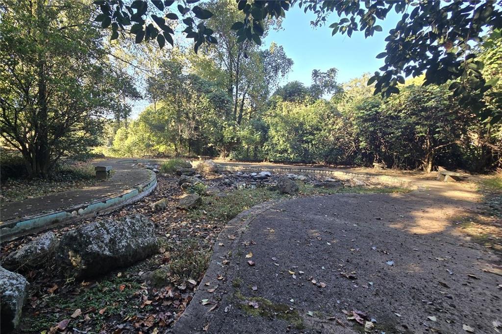 1418 Foxhall Lane Southeast, Unit 8 Atlanta, GA 30316 - Photo 38 of 50 a view of dirt yard with a large tree