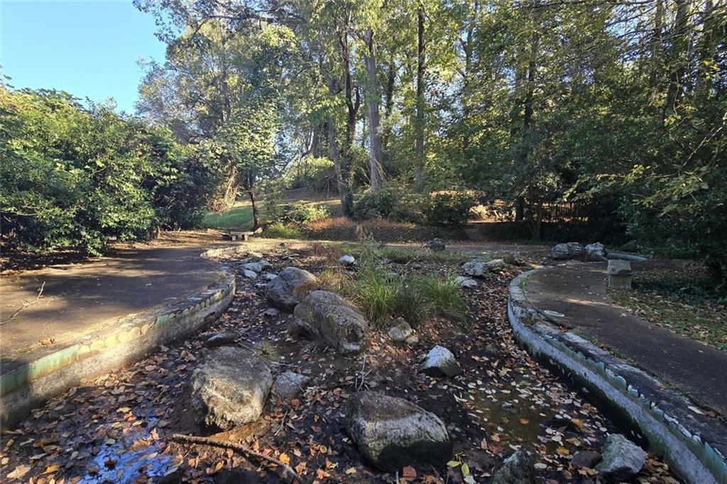 1418 Foxhall Lane Southeast, Unit 8 Atlanta, GA 30316 - Photo 43 of 50 a view of a dirt road with trees