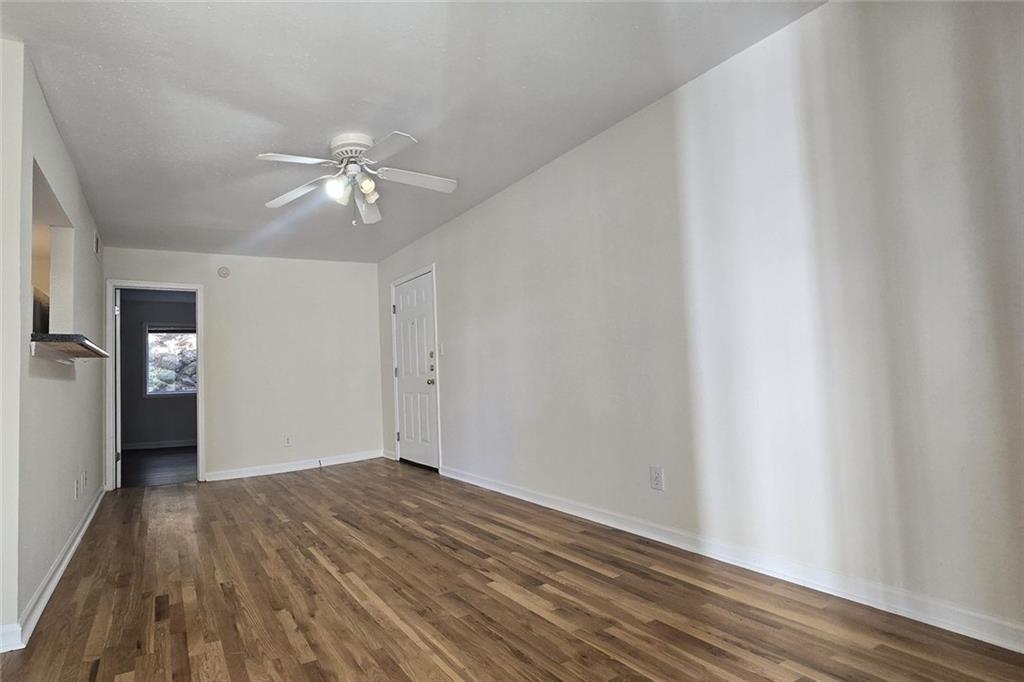 1418 Foxhall Lane Southeast, Unit 8 Atlanta, GA 30316 - Photo 8 of 41 wooden floor in an empty room with a window