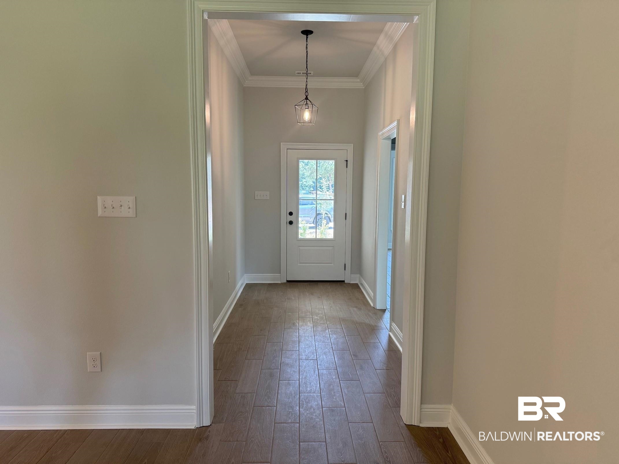 860 Sumter Loop Foley, AL 36535 - Photo 3 of 26 Doorway featuring crown molding and hardwood / wood-style floors