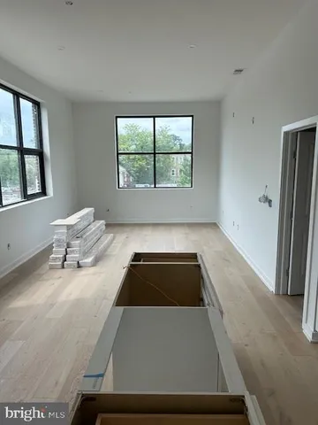 a living room with a couch and a window