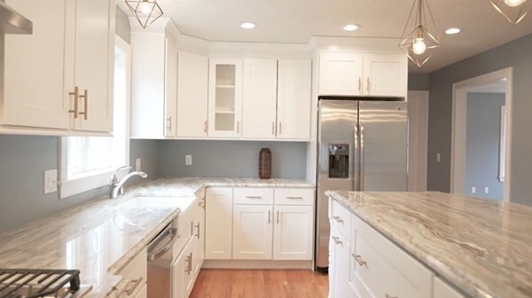 77 Woodside Avenue Rutland, MA 01543 - Photo 3 of 30 a kitchen with a sink a refrigerator and a stove