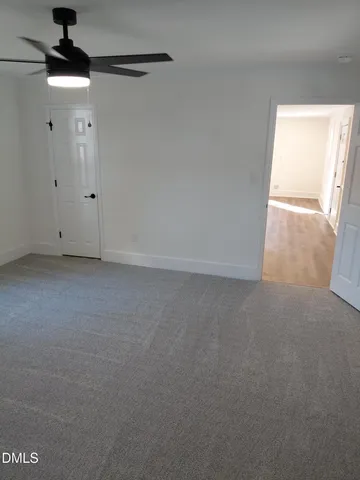 a view of empty room with windows