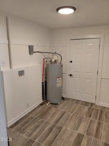 a view of a storage & utility room with closet