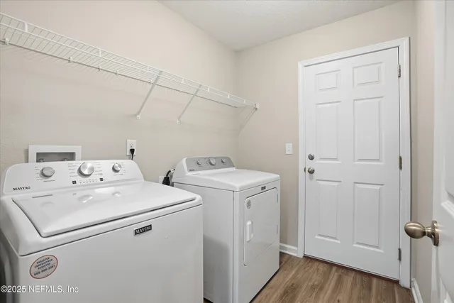 a utility room with dryer and washer
