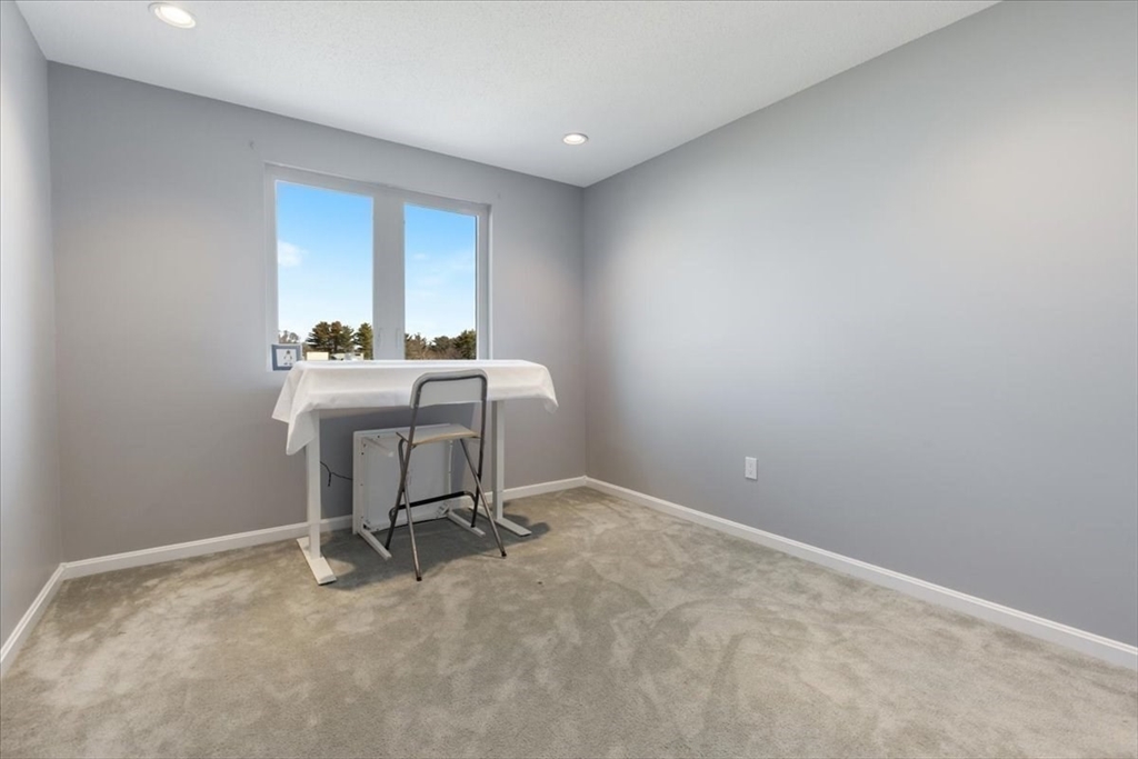 36 Dunham Road, Unit 302 Beverly, MA 01915 - Photo 17 of 21 a workspace with furniture and window