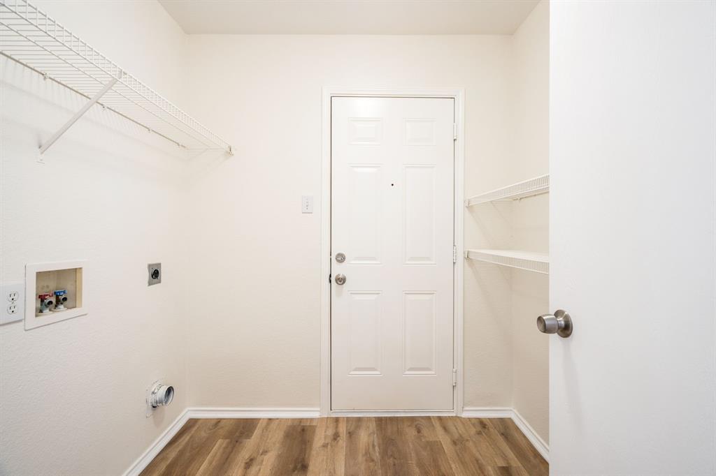 1626 White Oak Road Anna, TX 75409 - Photo 6 of 30 a view of a room with rack on the wall