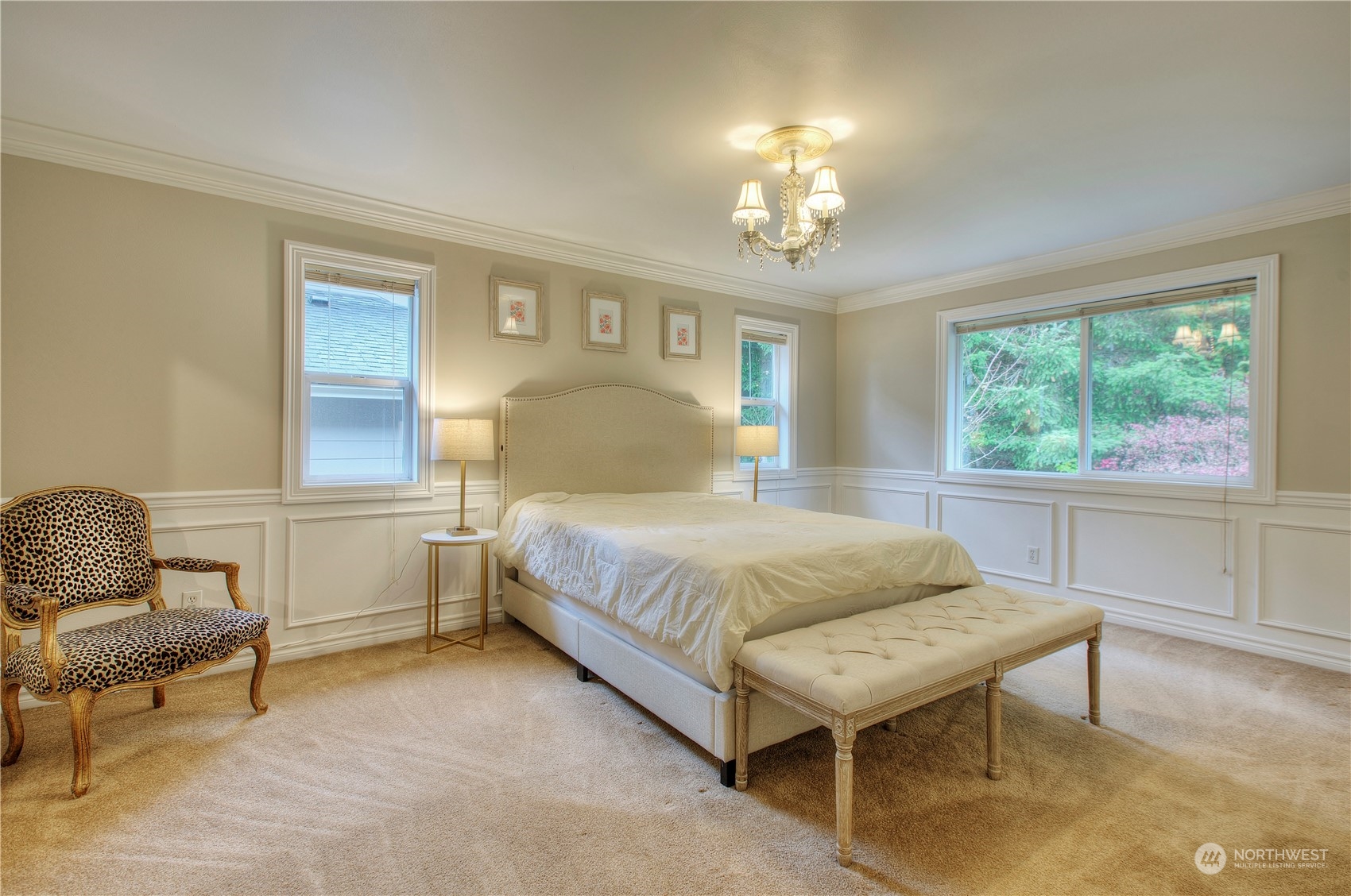 1013 R Street Northwest Auburn, WA 98001 - Photo 18 of 31 a bedroom with a bed and a chandelier