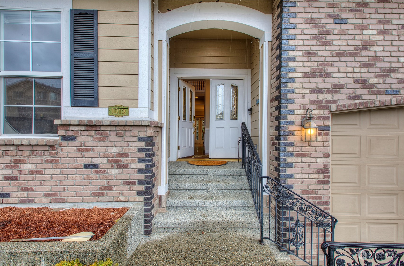 1013 R Street Northwest Auburn, WA 98001 - Photo 2 of 31 a front view of a house with a yard