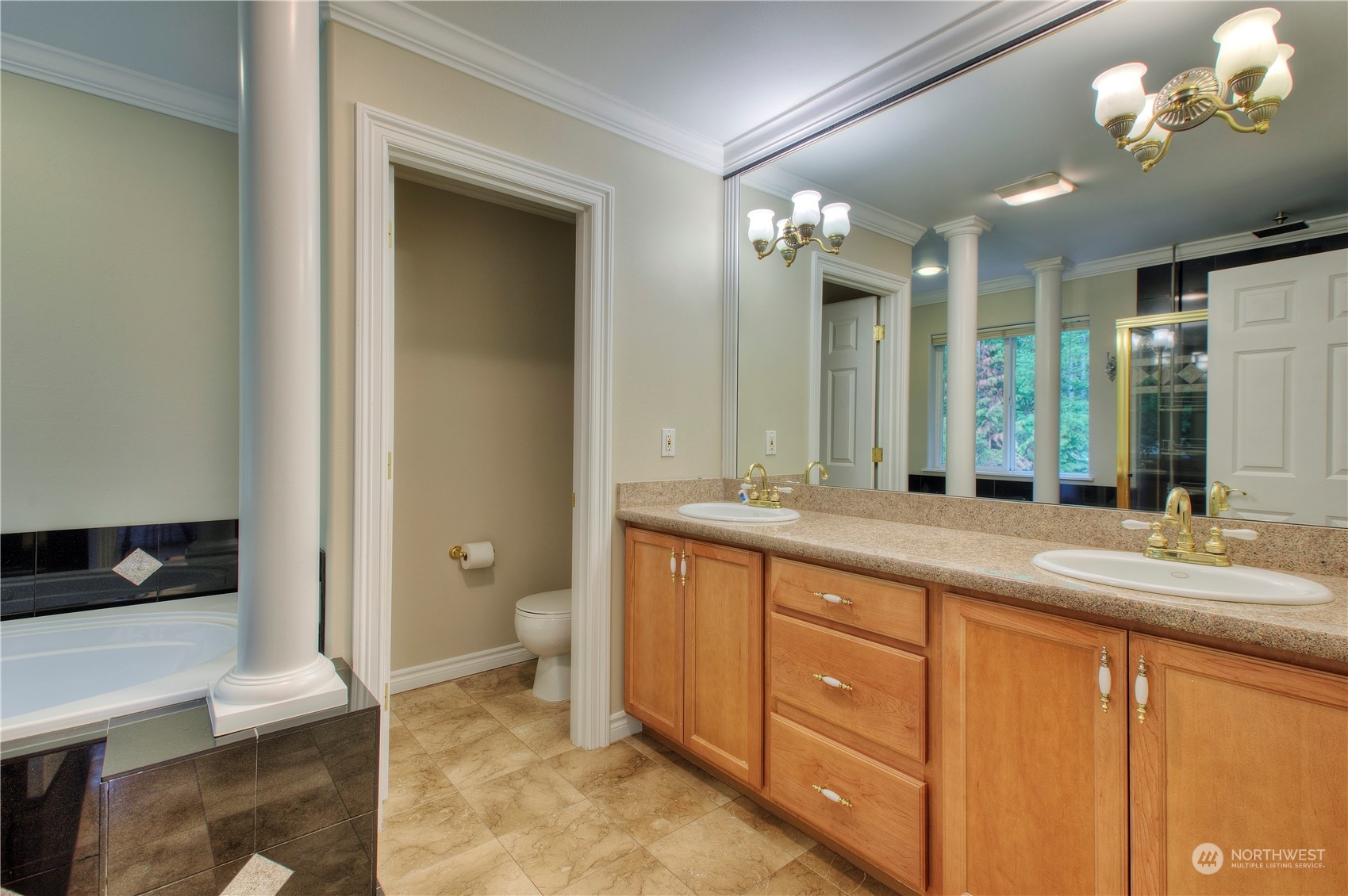 1013 R Street Northwest Auburn, WA 98001 - Photo 21 of 31 a spacious bathroom with a granite countertop sink a toilet and a mirror