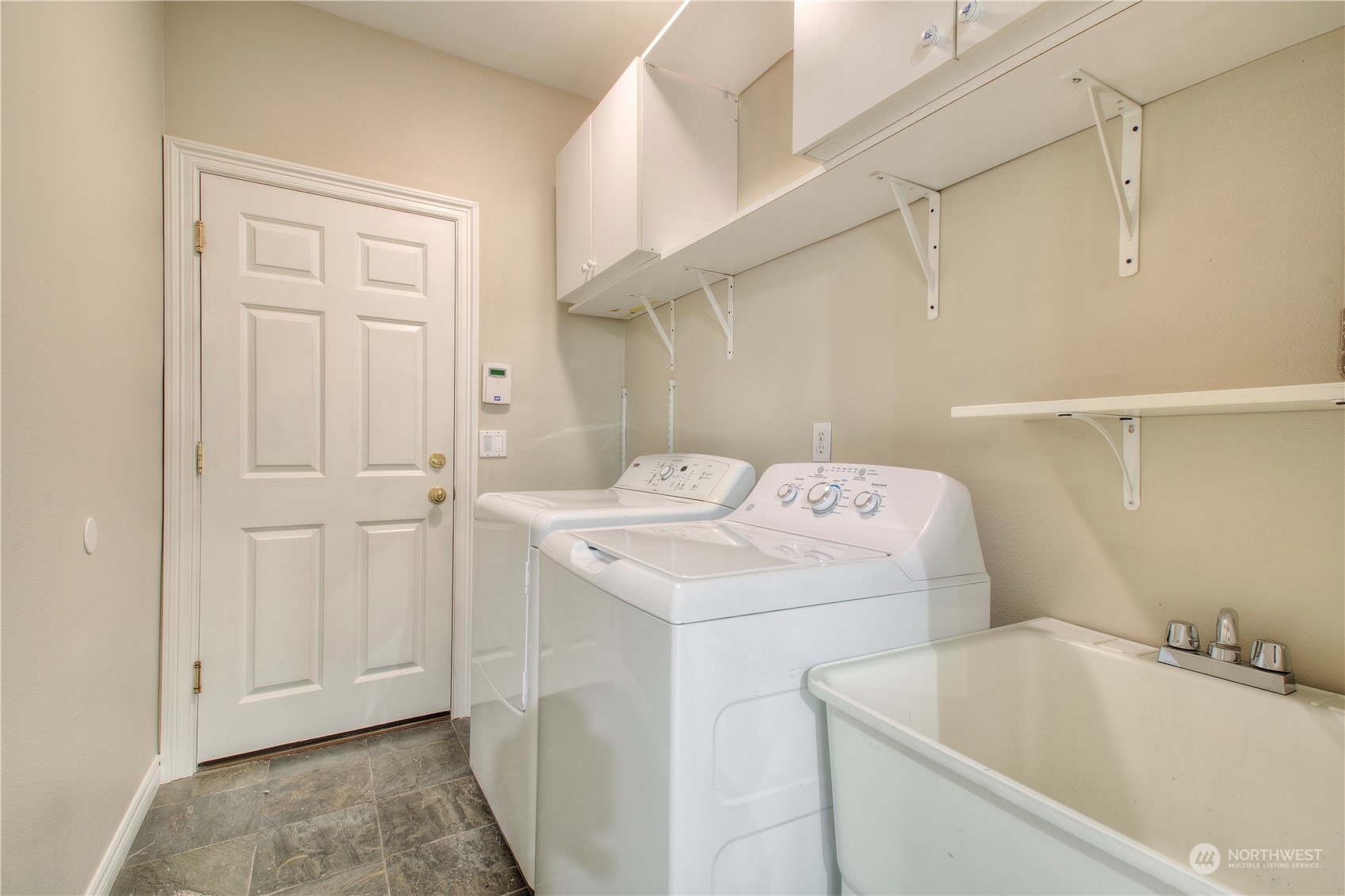 1013 R Street Northwest Auburn, WA 98001 - Photo 28 of 31 a utility room with dryer and washer