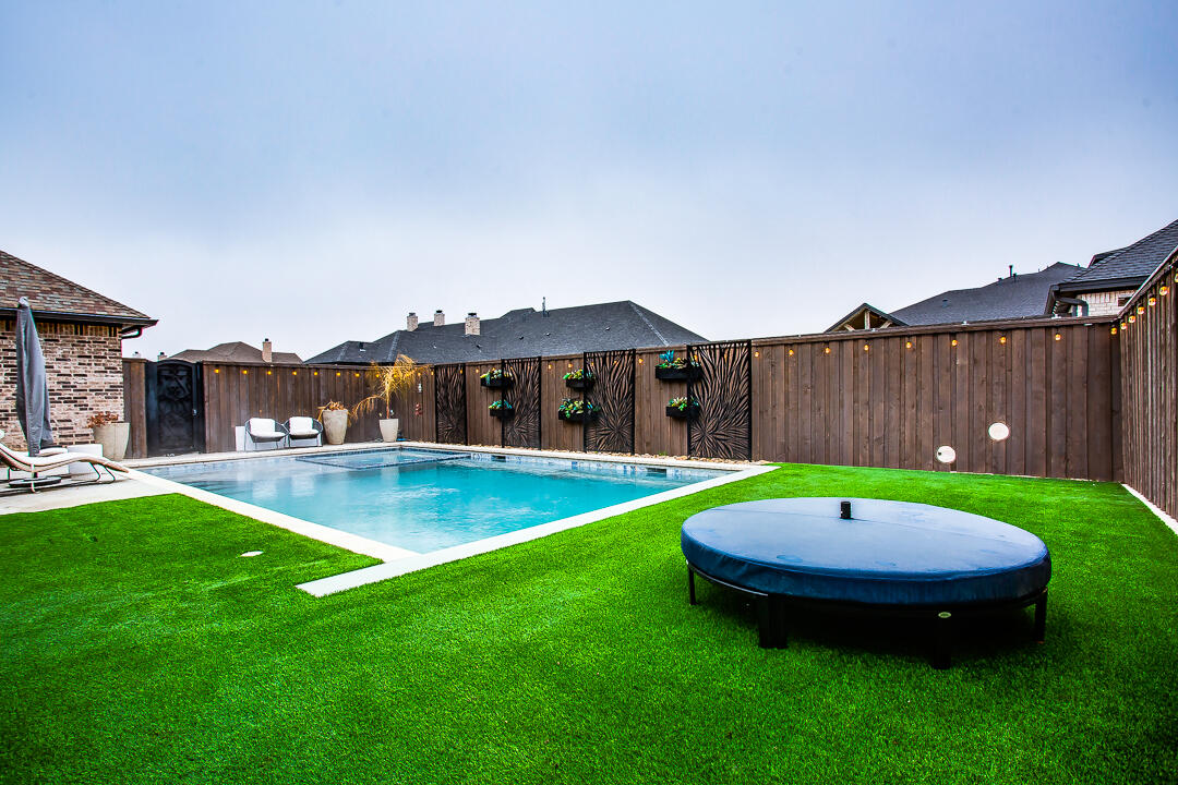 4821 119th Place Lubbock, TX 79424 - Photo 49 of 77 a view of pool with a backyard