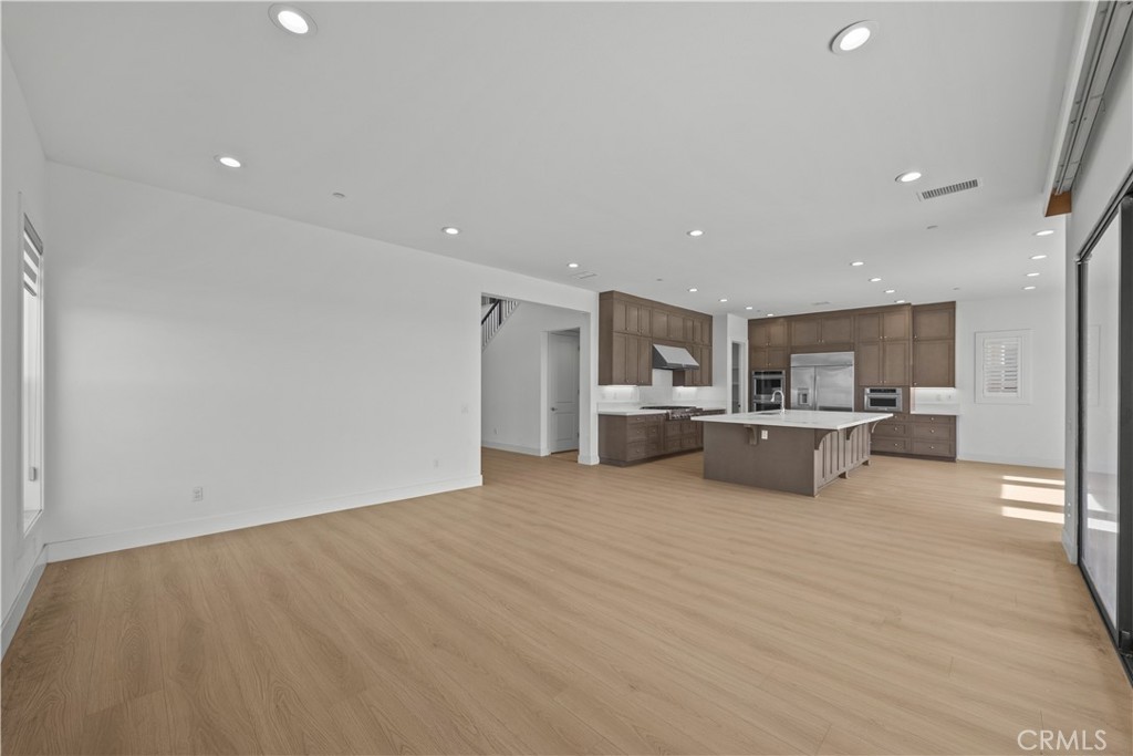 20638 Deer Grass Court Porter Ranch, CA 91326 - Photo 15 of 50 a view of kitchen with wooden floor