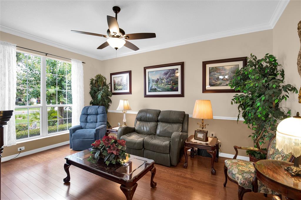 16411 Southwest 14th Avenue Road Ocala, FL 34473 - Photo 6 of 59 a living room with furniture and a large window