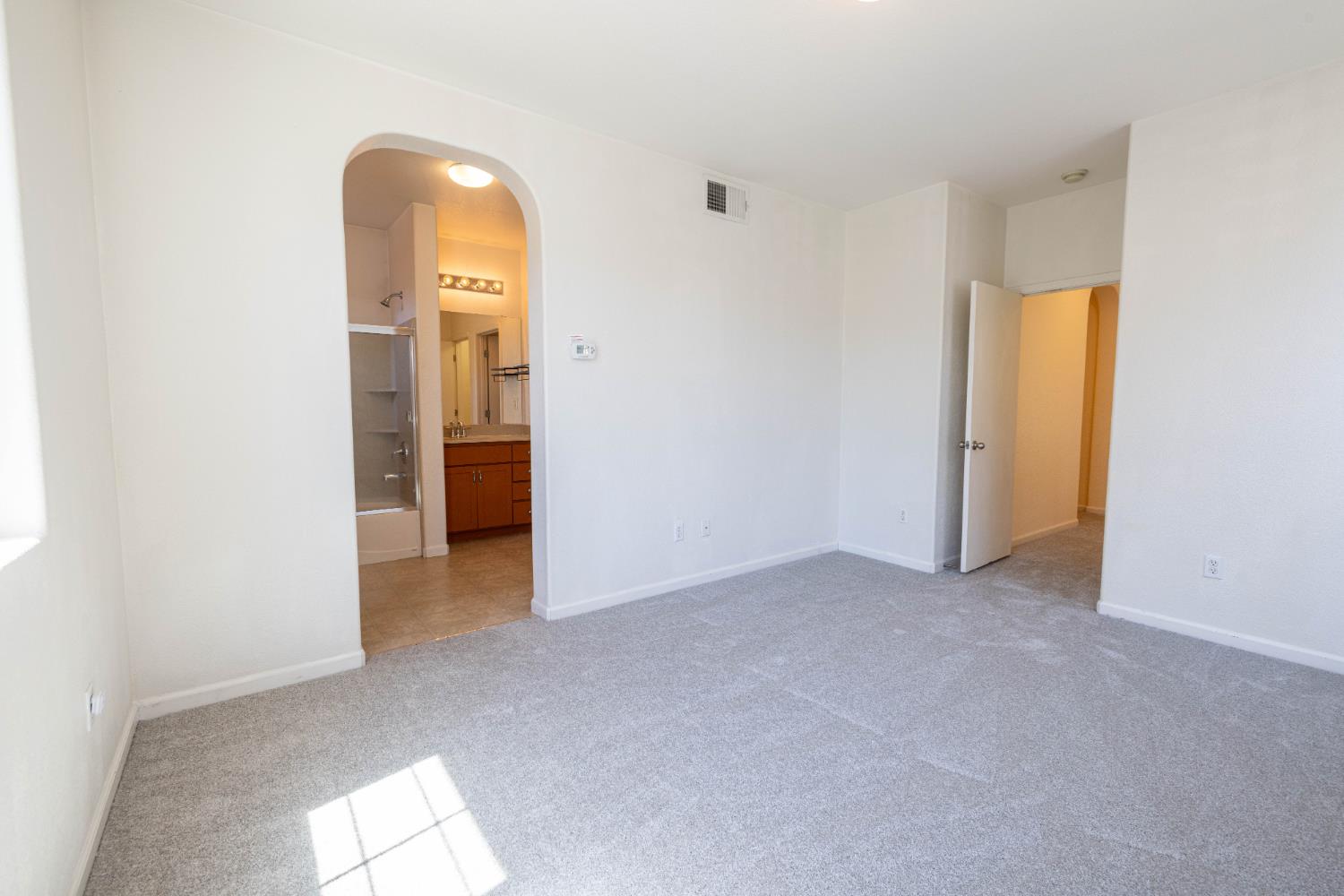 3122 Lea Sterling Way Rancho Cordova, CA 95670 - Photo 14 of 31 an empty room with closet and wooden door