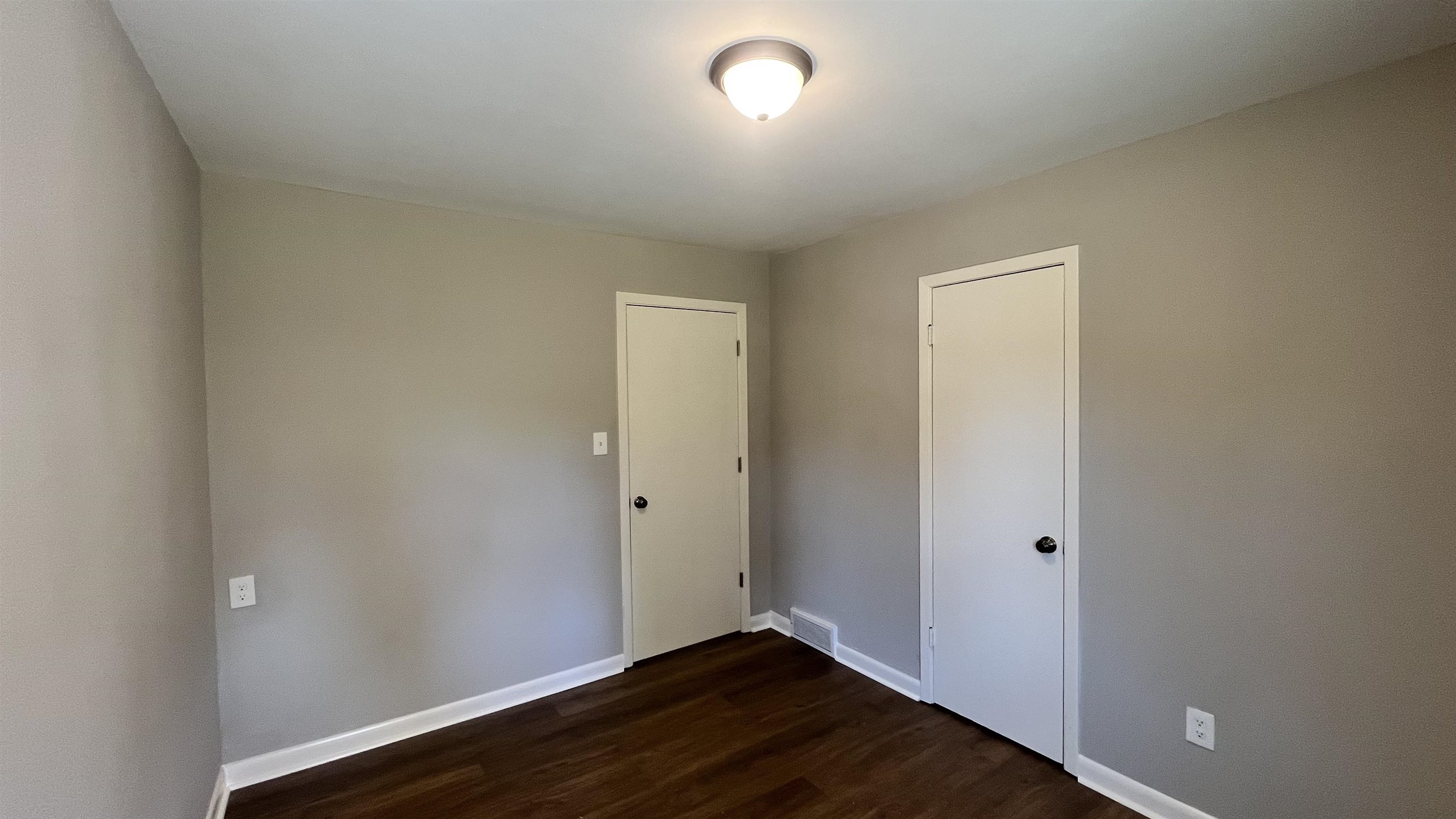 121 West Street Collierville, TN 38017 - Photo 14 of 16 an empty room with wooden floor and windows