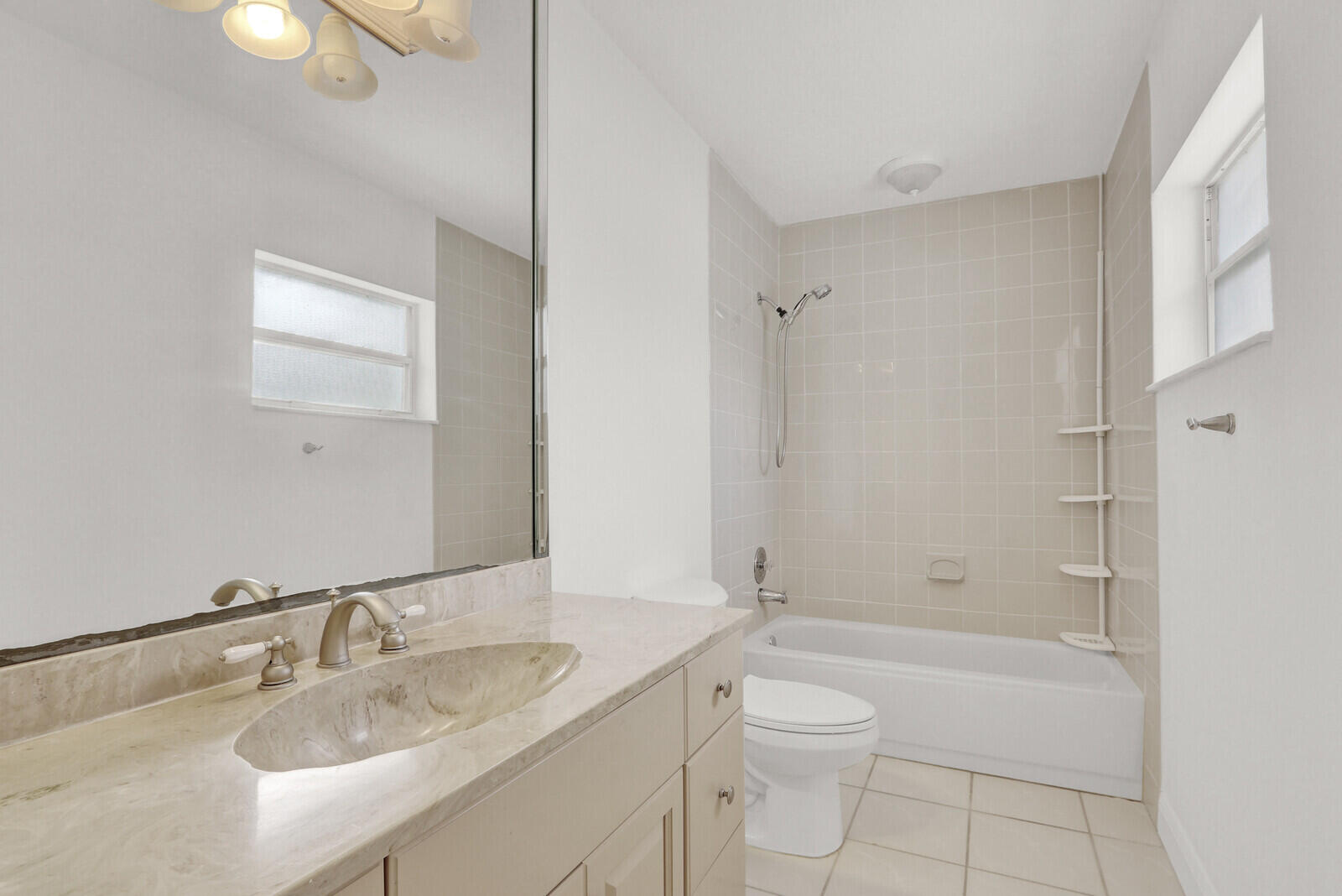 22600 Southwest 65th Way Boca Raton, FL 33428 - Photo 15 of 46 a bathroom with a granite countertop sink a toilet and shower