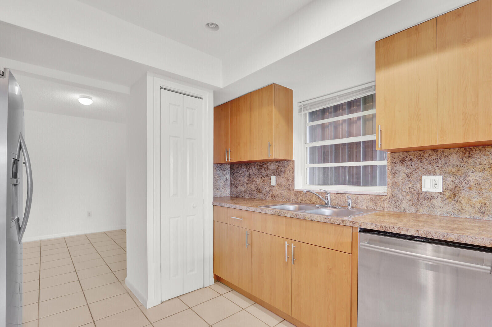 22600 Southwest 65th Way Boca Raton, FL 33428 - Photo 5 of 46 a kitchen with granite countertop a sink and a stove