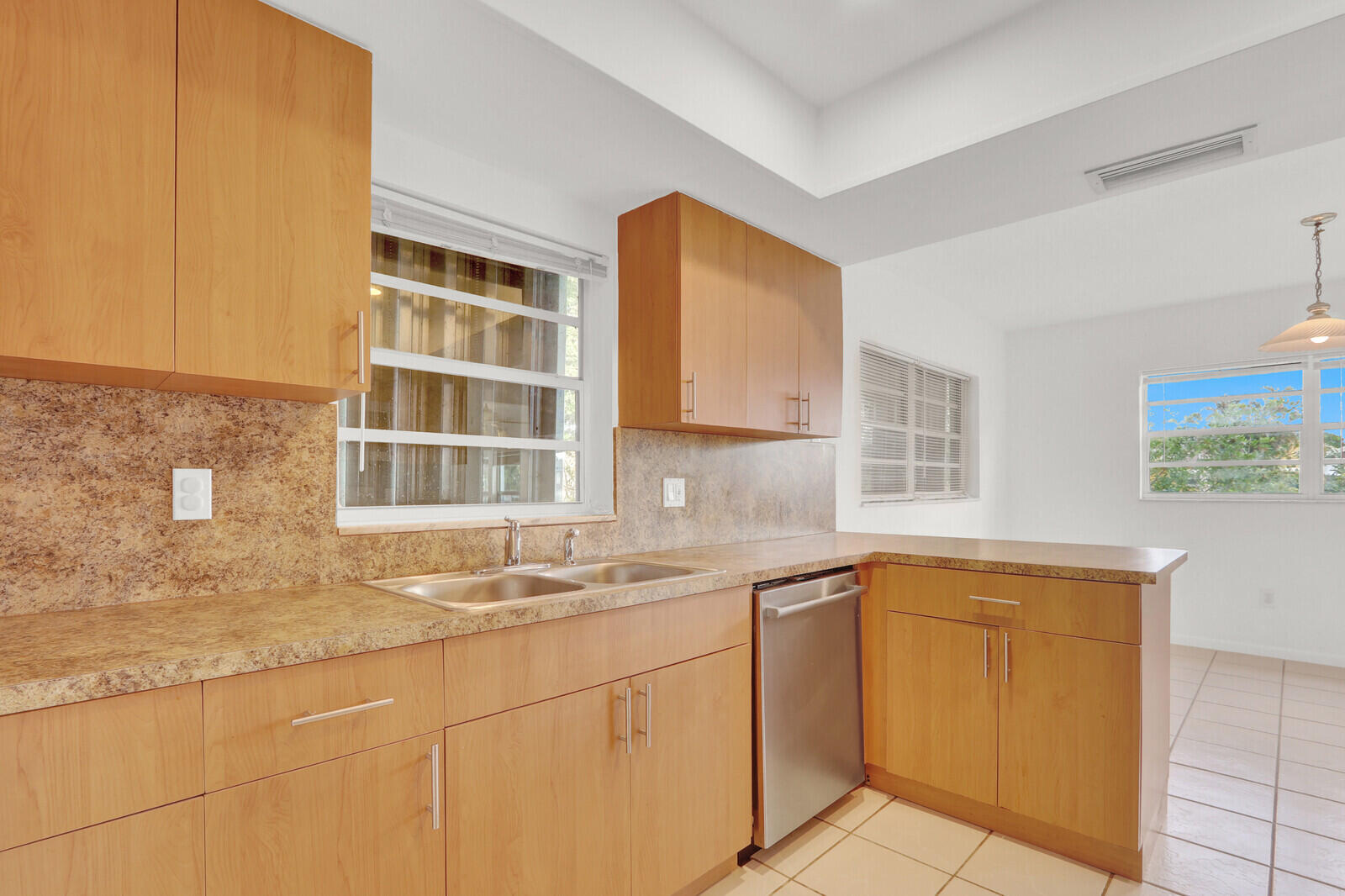22600 Southwest 65th Way Boca Raton, FL 33428 - Photo 7 of 46 a kitchen with stainless steel appliances granite countertop a sink and cabinets