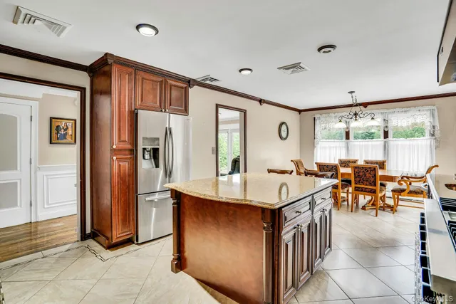 a very nice looking dining room with a large window