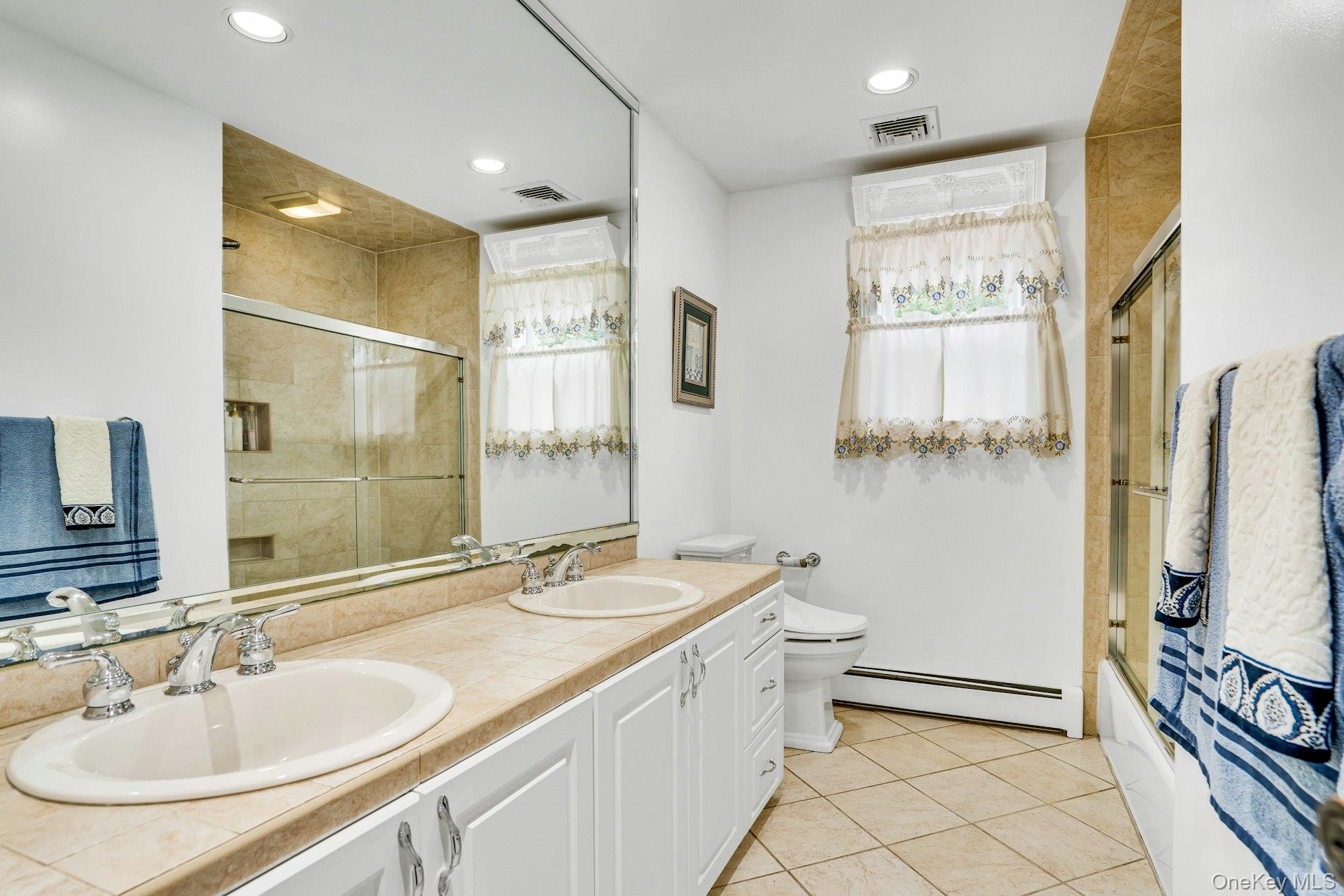 41 Hearthstone Drive Dix Hills, NY 11746 - Photo 26 of 50 a bathroom with a granite countertop sink mirror and a bathtub