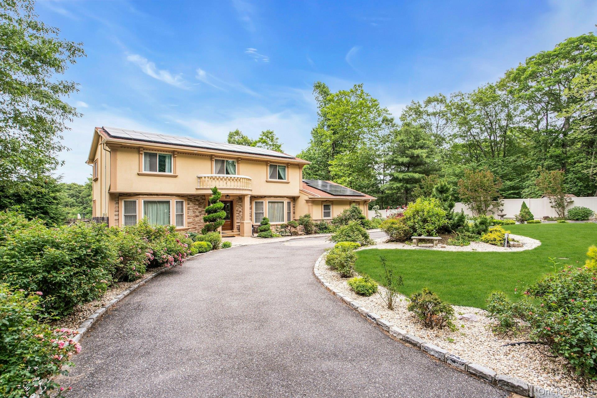 41 Hearthstone Drive Dix Hills, NY 11746 - Photo 3 of 50 a front view of a house with a yard and potted plants