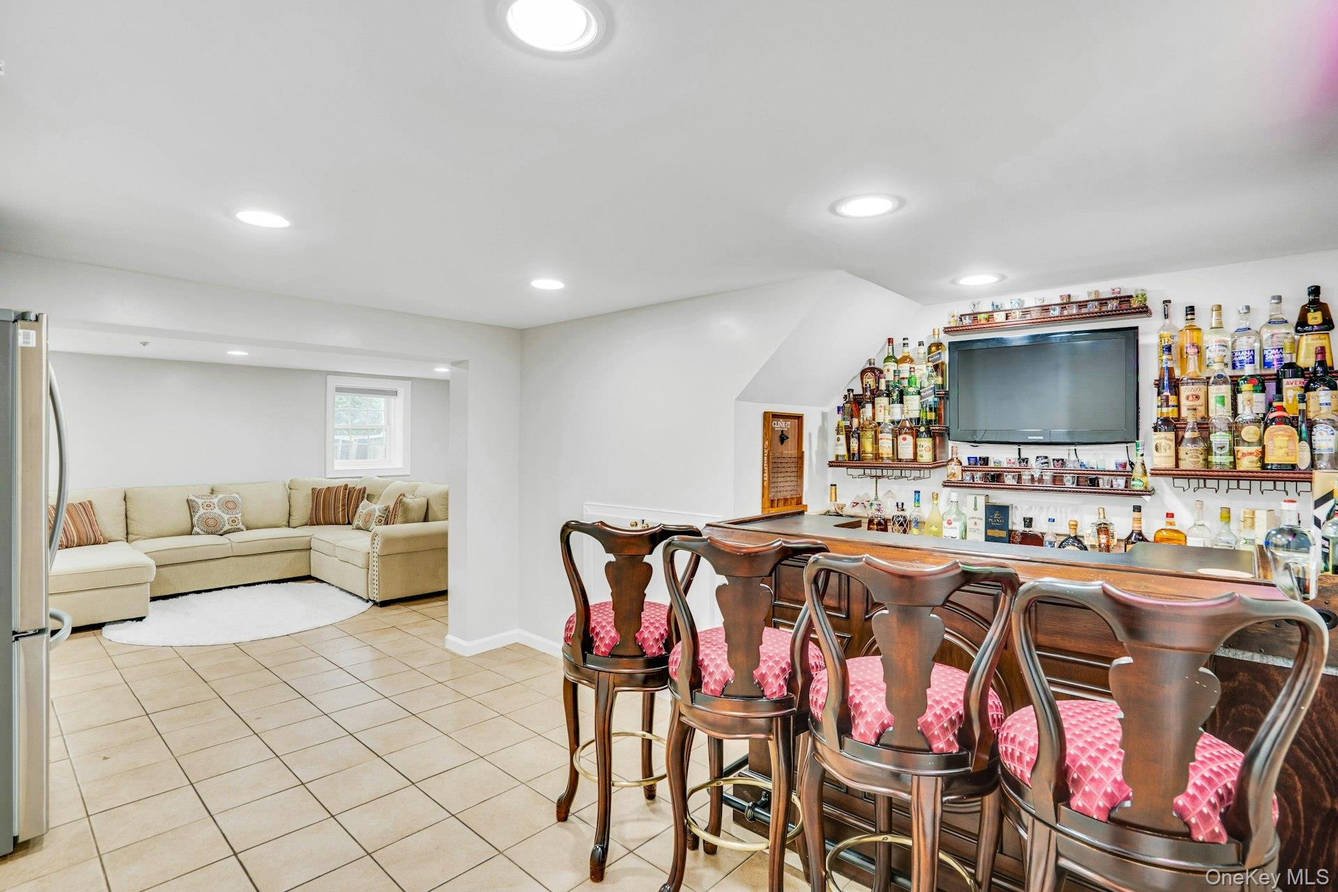 41 Hearthstone Drive Dix Hills, NY 11746 - Photo 36 of 50 a living room with furniture and a flat screen tv