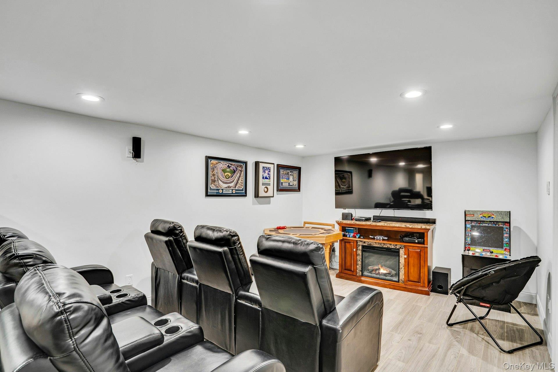 41 Hearthstone Drive Dix Hills, NY 11746 - Photo 37 of 50 a living room with furniture a flat screen tv and a fireplace