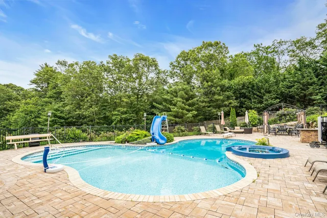 a view of a swimming pool with a patio