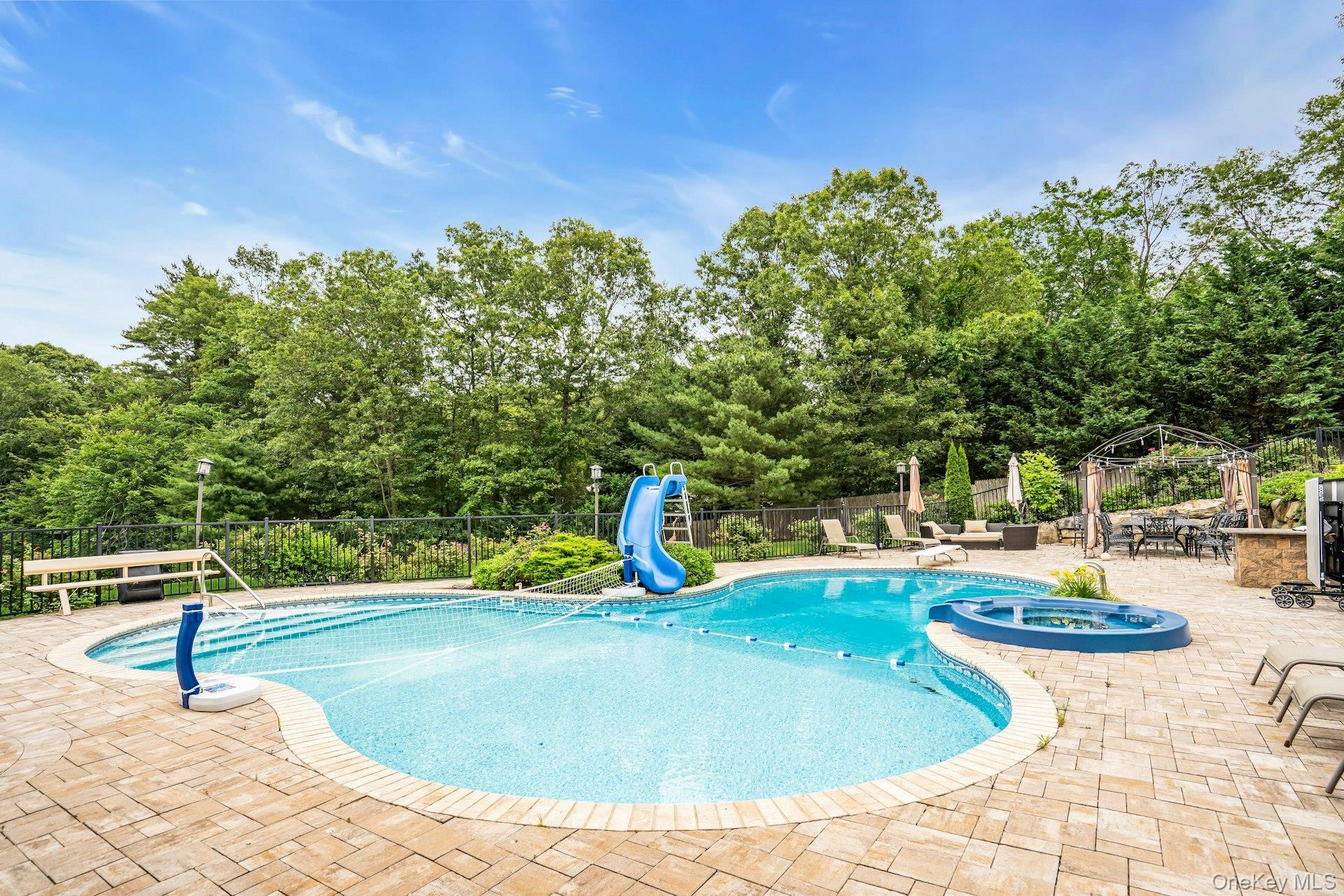 41 Hearthstone Drive Dix Hills, NY 11746 - Photo 46 of 50 a view of a swimming pool with a patio