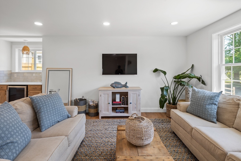 6 Stenbeck Place Scituate, MA 02066 - Photo 11 of 24 a living room with furniture and a flat screen tv