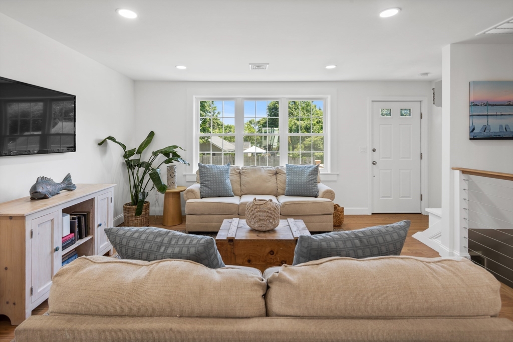 6 Stenbeck Place Scituate, MA 02066 - Photo 12 of 24 a living room with furniture and a flat screen tv