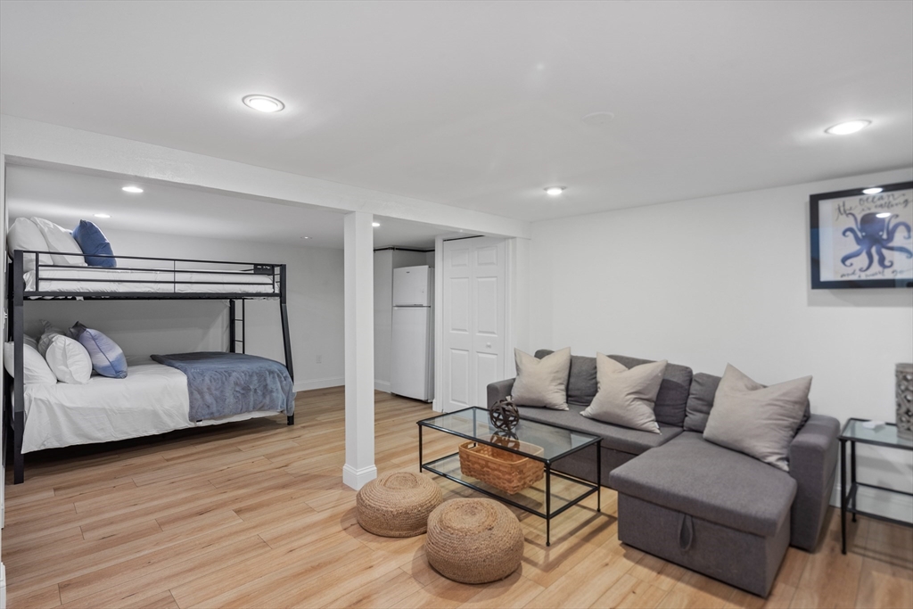 6 Stenbeck Place Scituate, MA 02066 - Photo 18 of 24 a living room with furniture and a wooden floor