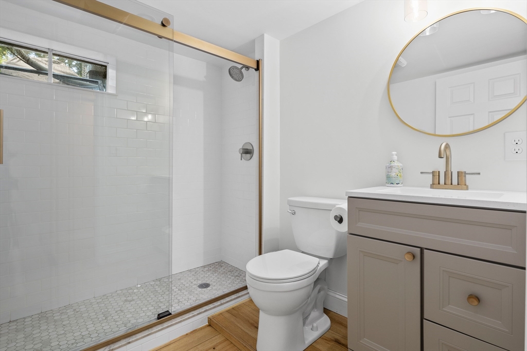 6 Stenbeck Place Scituate, MA 02066 - Photo 19 of 24 a bathroom with a toilet a sink and mirror