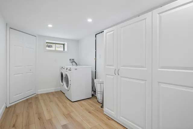 a view of a storage & utility room with a washer dryer