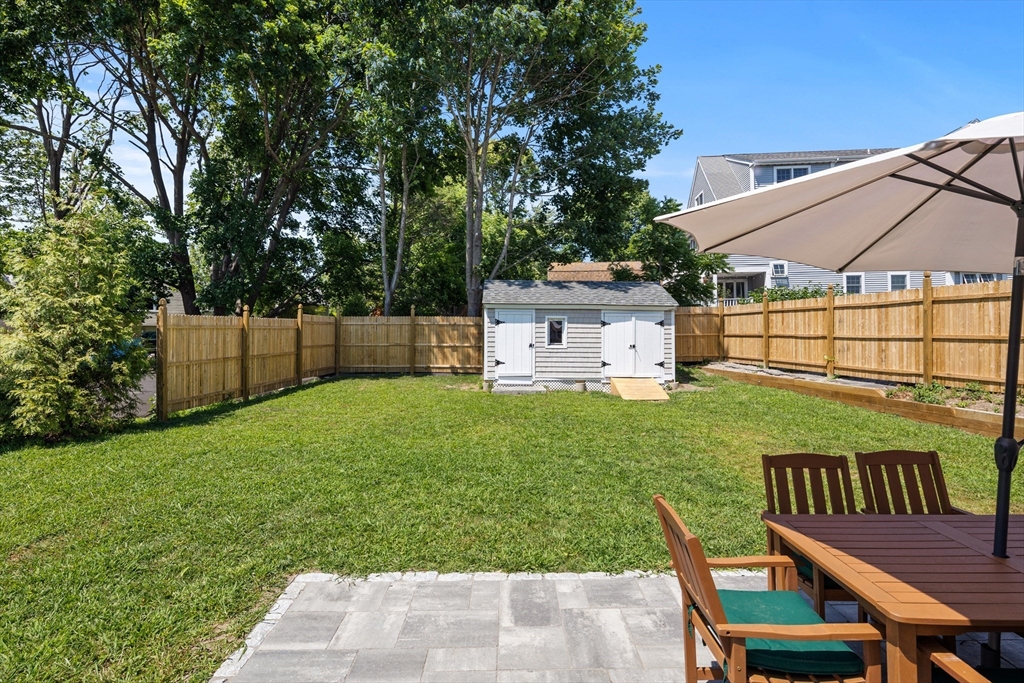 6 Stenbeck Place Scituate, MA 02066 - Photo 23 of 24 a view of a backyard with a sitting area